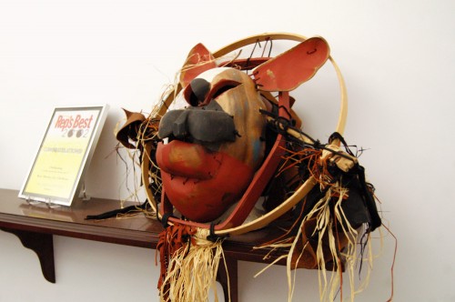 dog mask made of wooden bowls